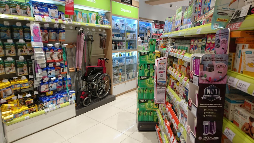 Interior view of a Watsons pharmacy aisle, showcasing health, wellness, and medical aid products.