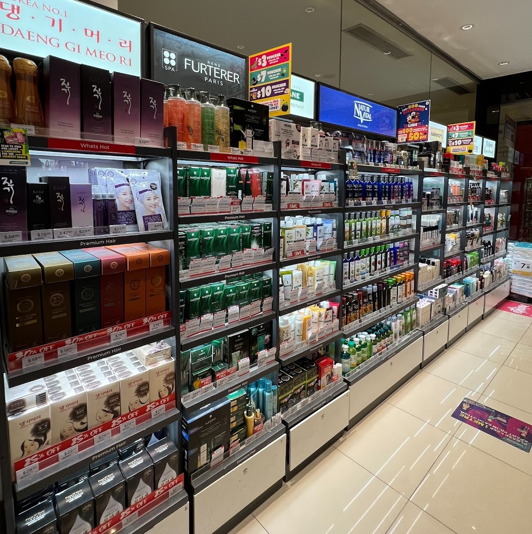 Shelves filled with a wide array of hair care and beauty products inside a Watsons store.