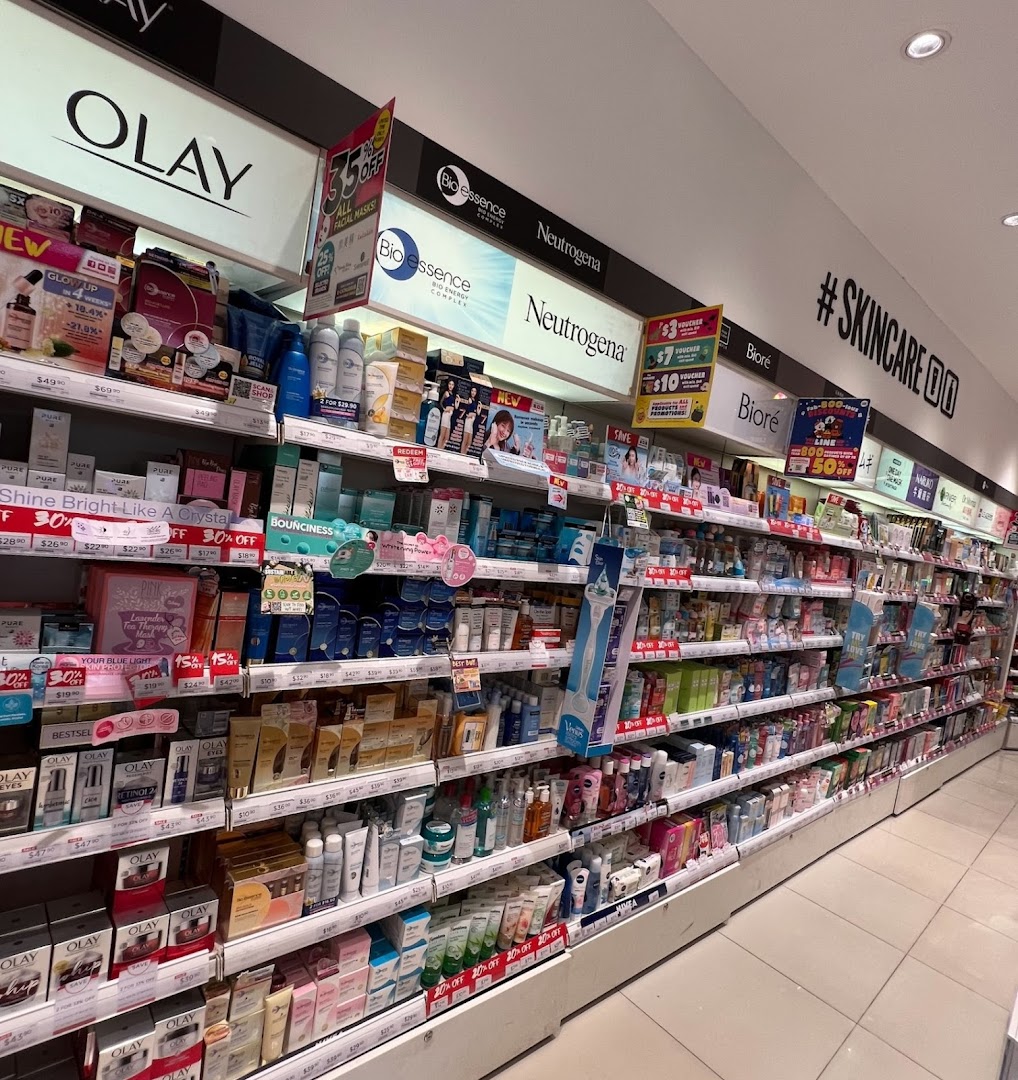 An aisle in a Watsons pharmacy displaying a wide range of skincare and beauty products.