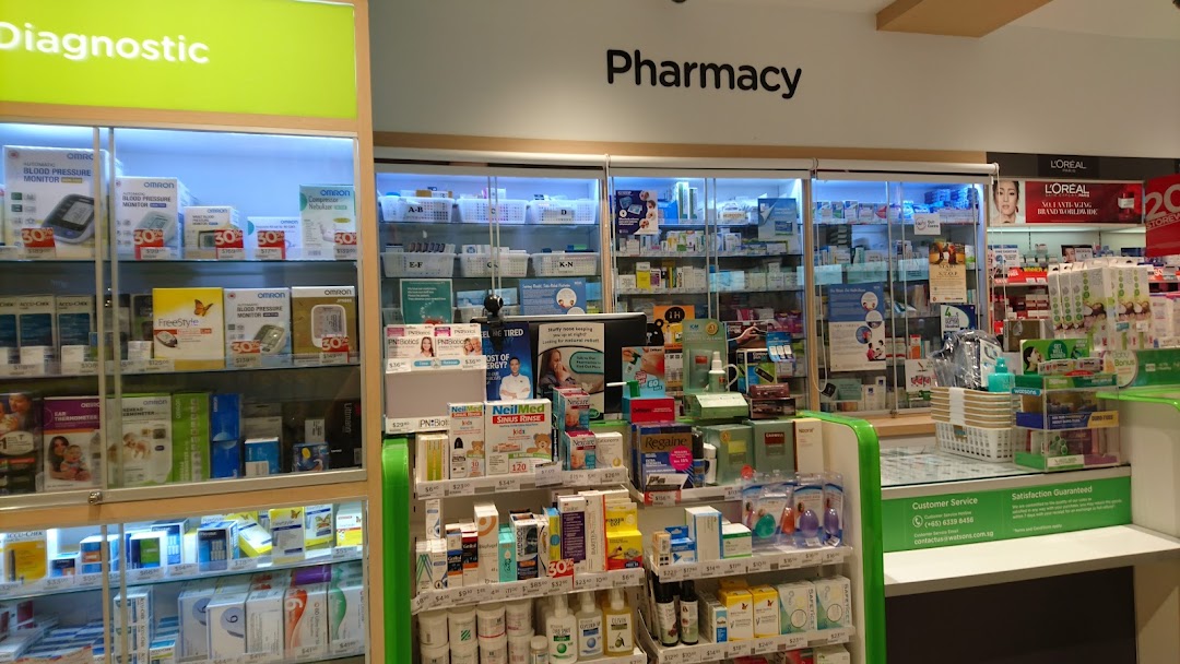 Interior view of Watsons pharmacy, showcasing diagnostic tools, health products, and a pharmacy counter.