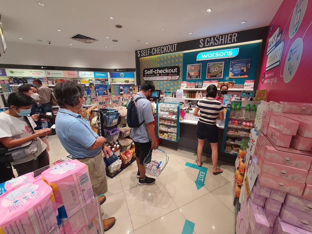 Customers queueing at Watsons pharmacy checkout, with self-checkout and cashier options visible.