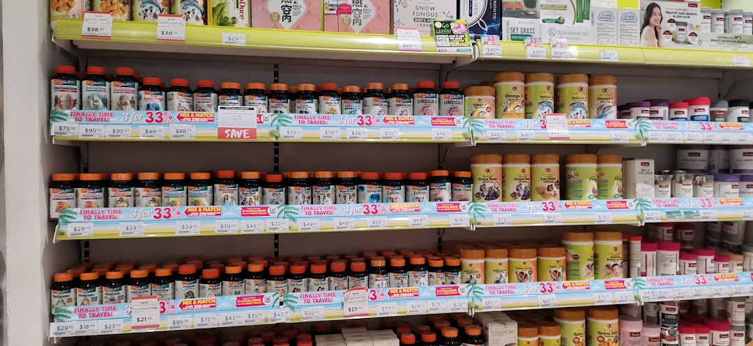 Shelves filled with health supplements and vitamins, featuring promotional offers.