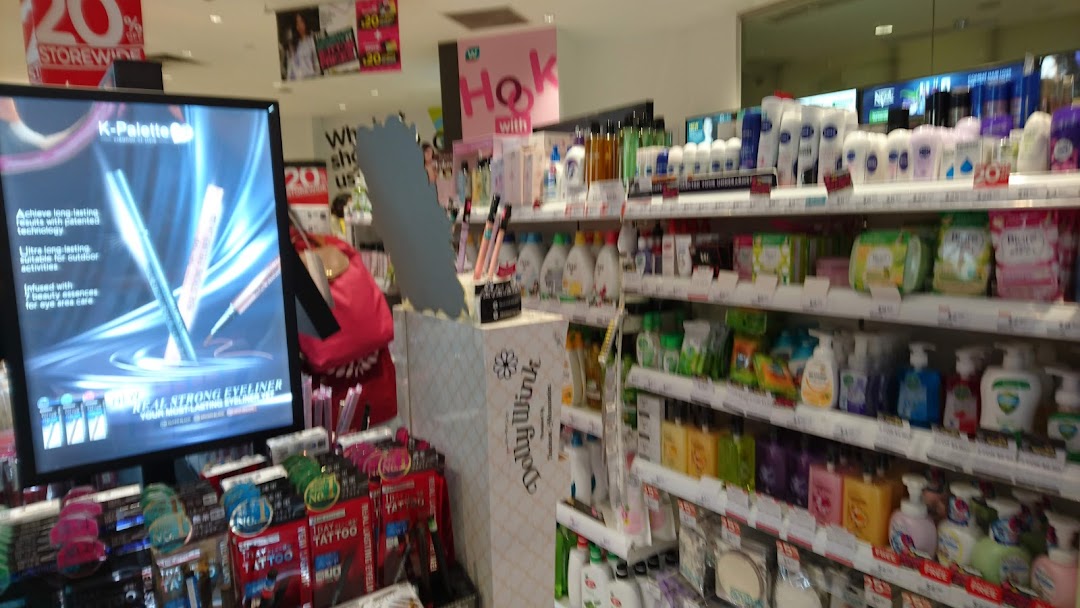 An aisle inside Watsons, showcasing a wide range of health, beauty, and personal care products.
