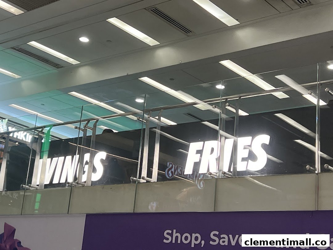 Bright signage for 'WINGS' and 'FRIES' visible from a distance within the mall.