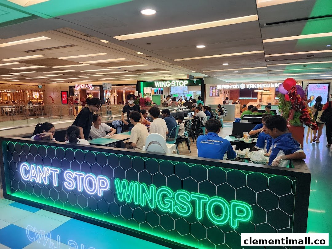 Customers enjoy meals in the vibrant Wingstop dining area at The Clementi Mall.