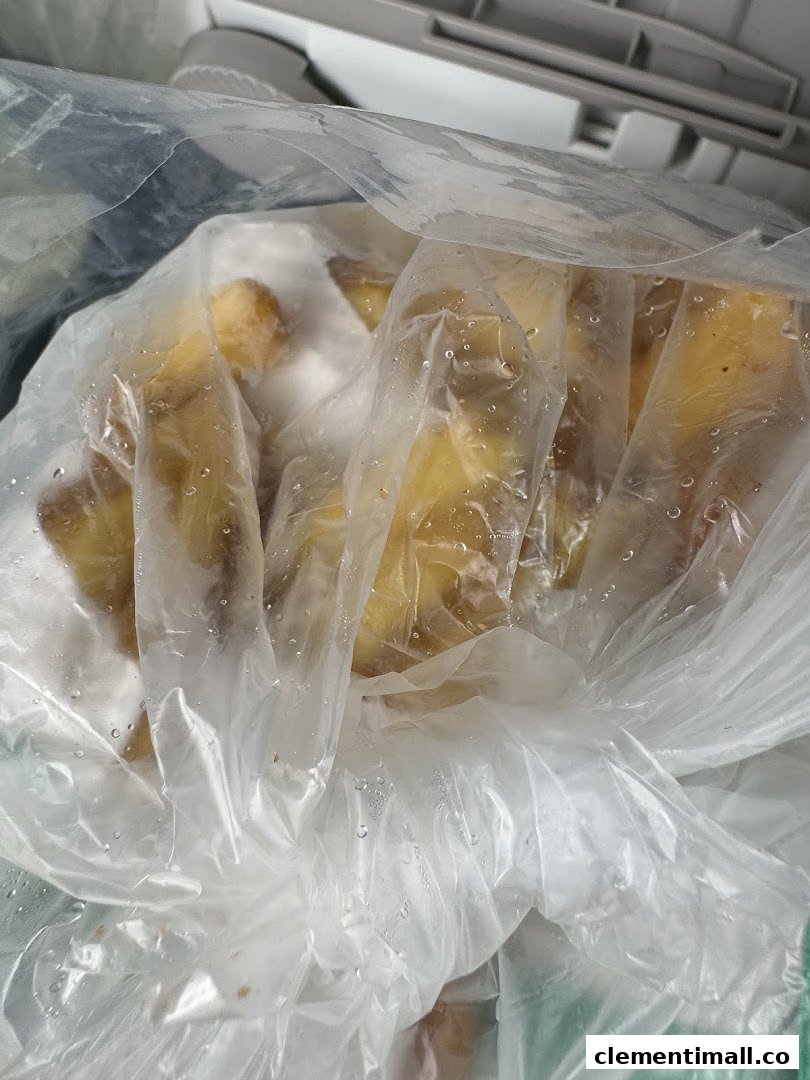 Frozen potato wedges or similar food items stored in a clear plastic bag.