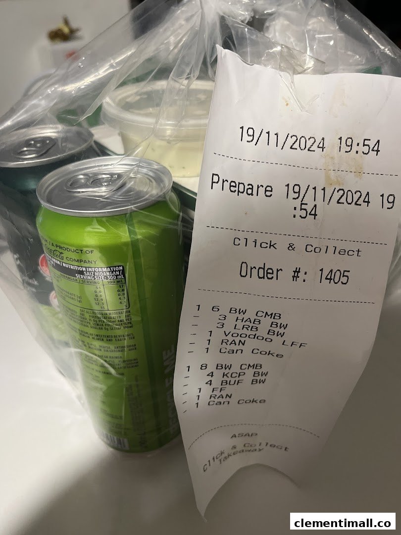 A plastic bag with Wingstop takeaway items, including drinks and a detailed order receipt.