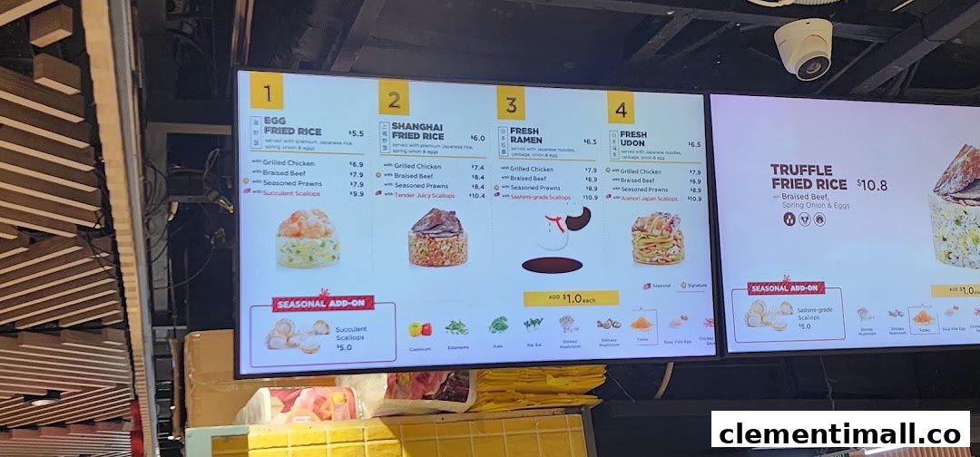 A digital menu board displaying various fried rice and noodle dishes with customizable protein options and add-ons.