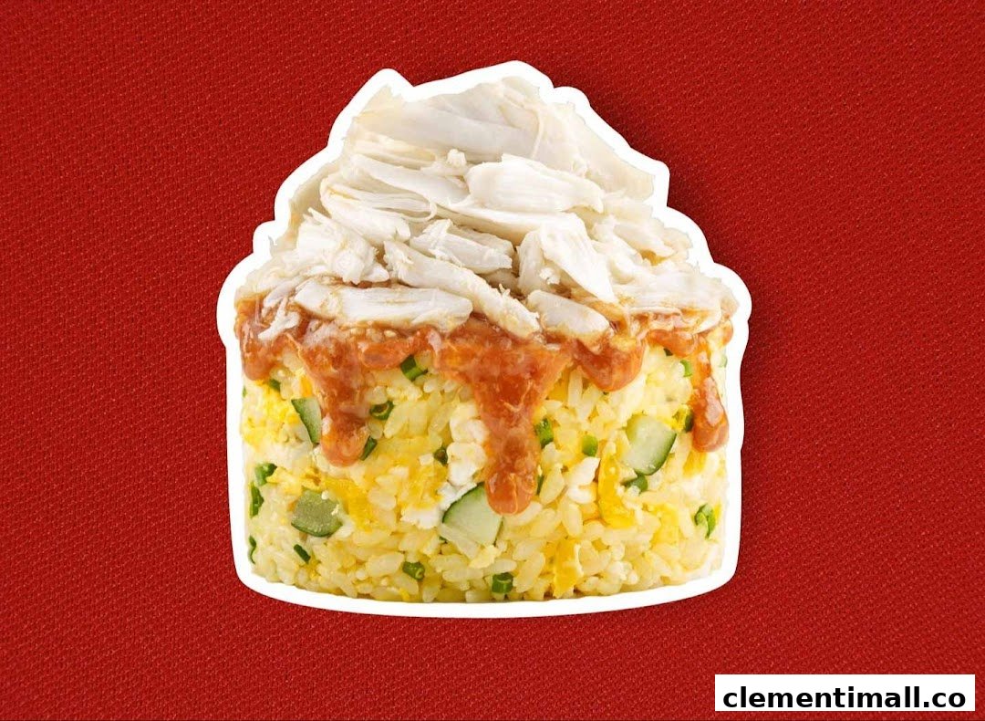 A vibrant image of fried rice topped with generous crab meat and a savory sauce.