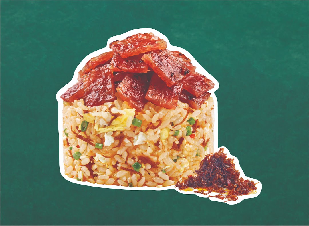 A vibrant image of fried rice topped with savory meat slices and floss, set against a green background.