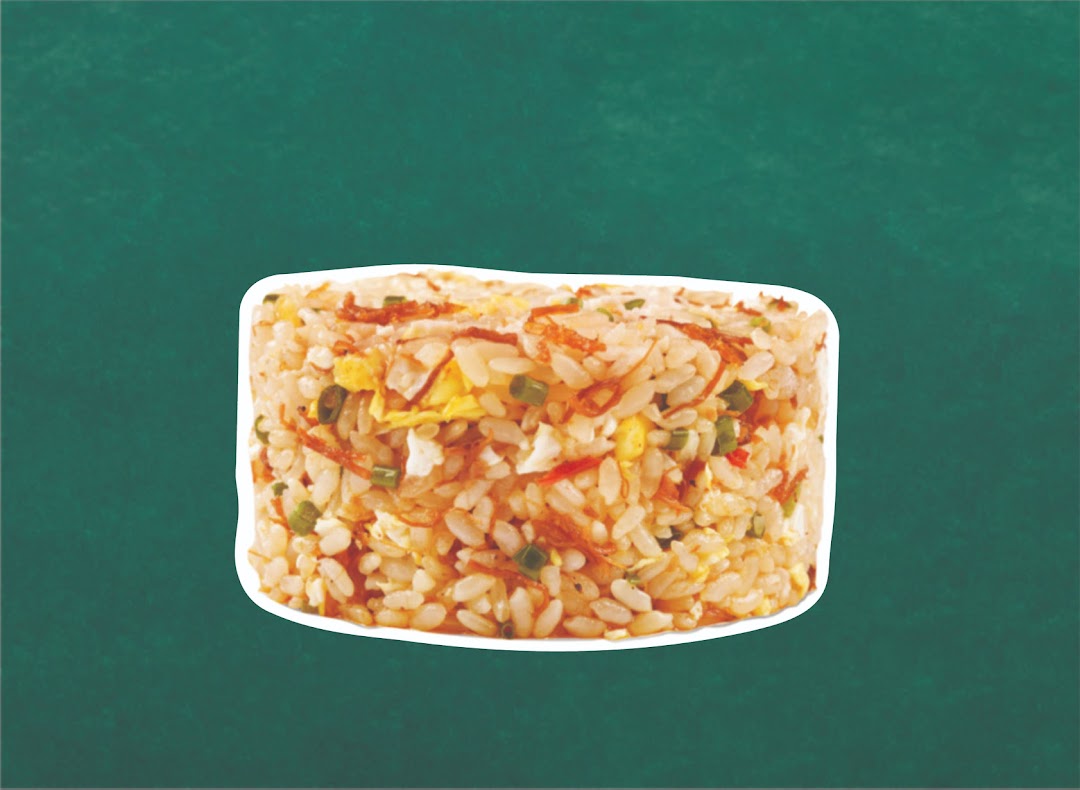 A close-up of delicious fried rice with egg, vegetables, and crispy toppings against a green background.