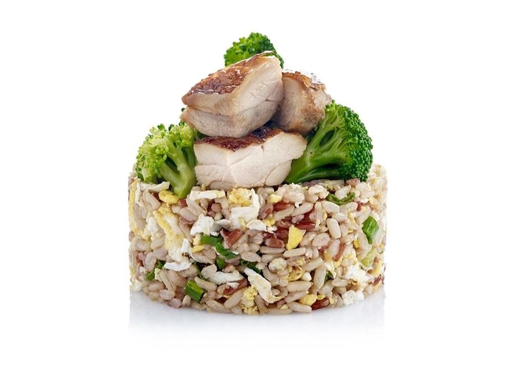 A vibrant dish of fried rice with chicken and broccoli, presented on a white background.