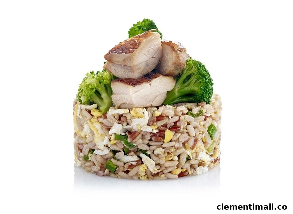 A vibrant dish of fried rice with chicken and broccoli, presented on a white background.