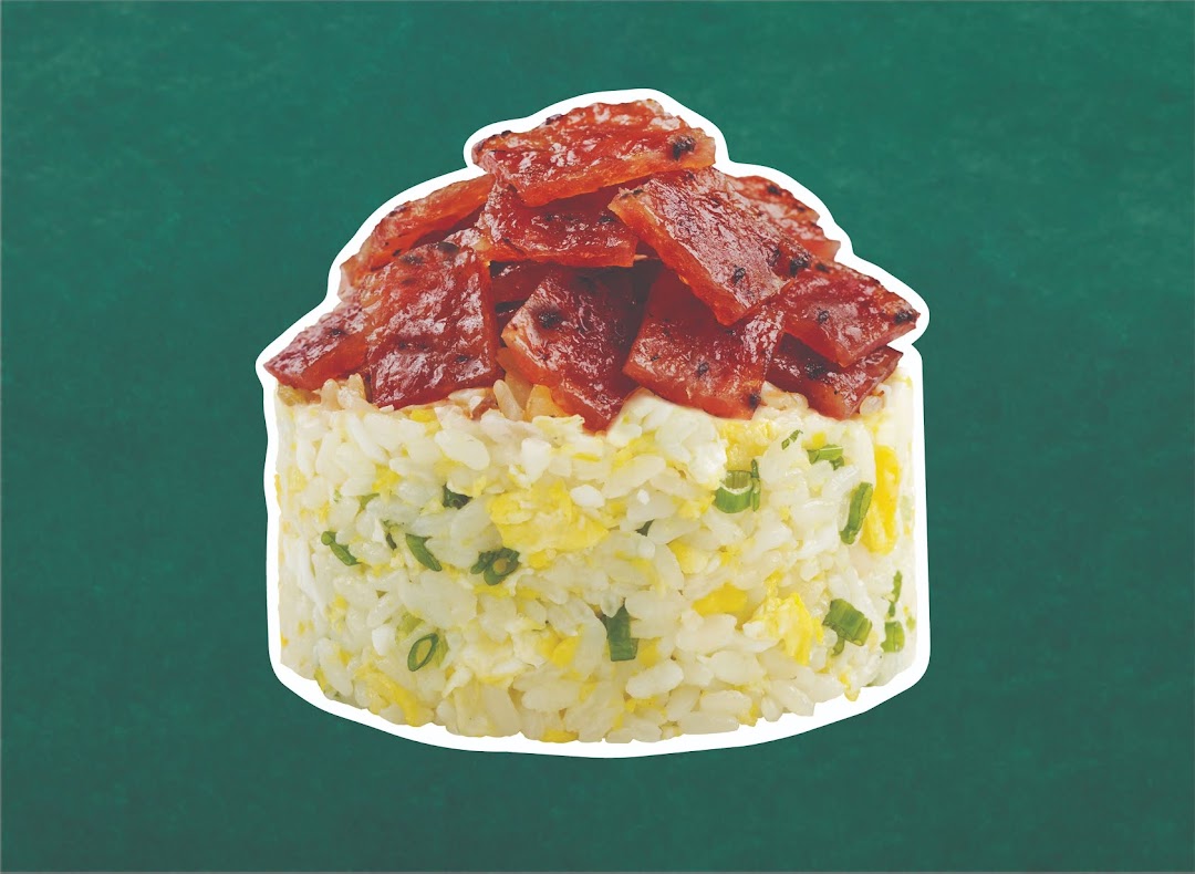 Close-up of Wok Hey's fried rice topped with savory bak kwa slices against a green background.