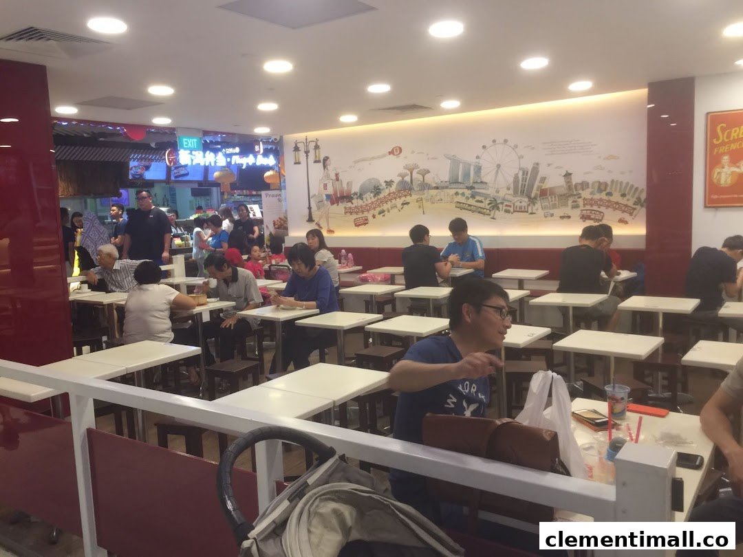 Customers enjoy meals in a brightly lit, bustling Ya Kun Kaya Toast restaurant interior with a Singapore skyline mural.