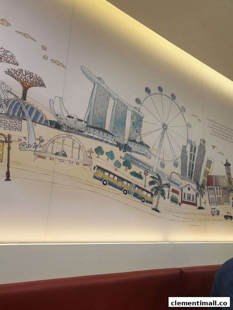 A vibrant wall mural depicting iconic Singapore landmarks inside Ya Kun Kaya Toast.