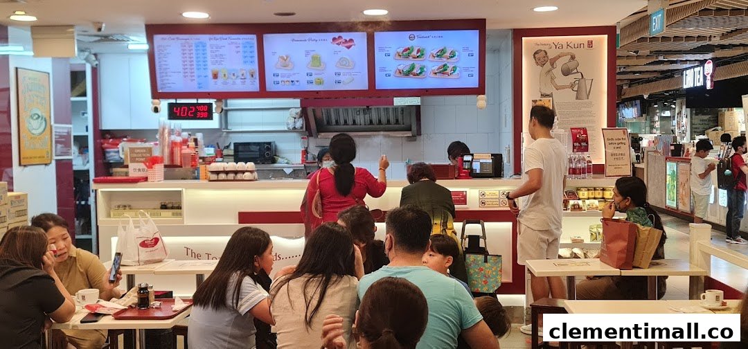 Customers and staff at Ya Kun Kaya Toast, with menu boards and a busy counter area.