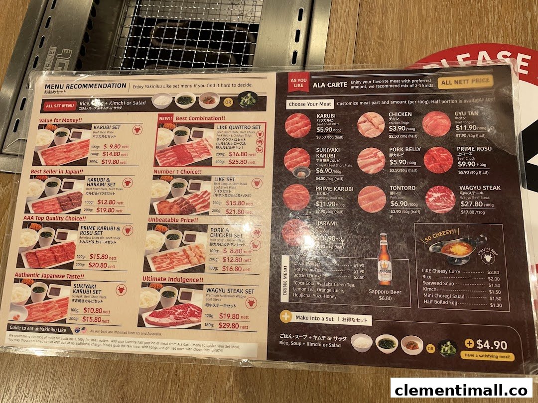 A detailed menu displaying various yakiniku sets, ala carte meat options, drinks, and add-ons.