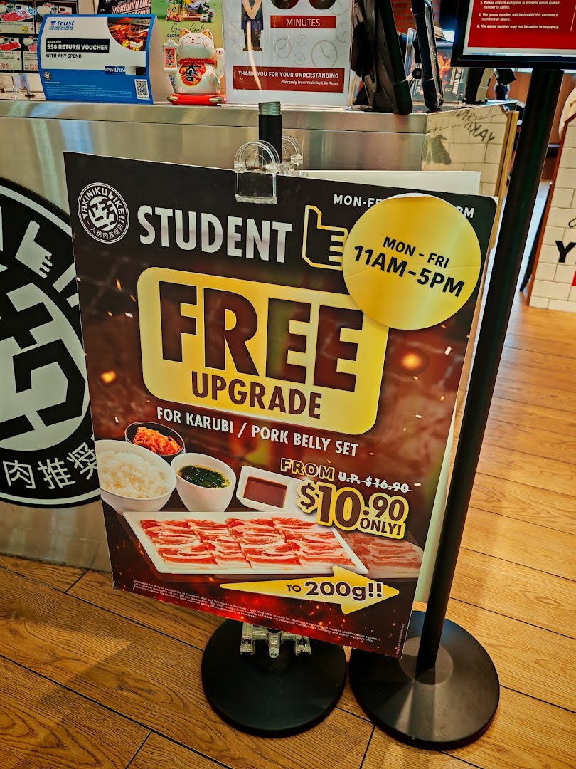 A promotional standee for Yakiniku Like's student offer on Karubi/Pork Belly sets.