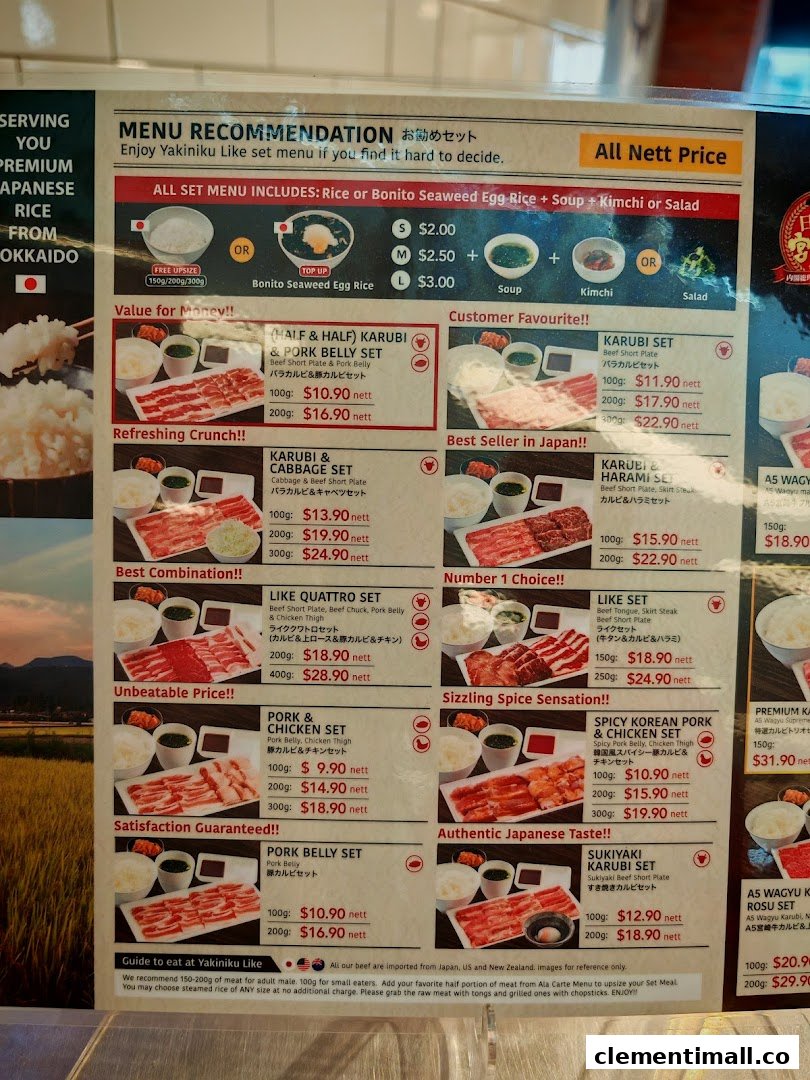 A detailed menu board displaying various yakiniku set meals with prices and descriptions.