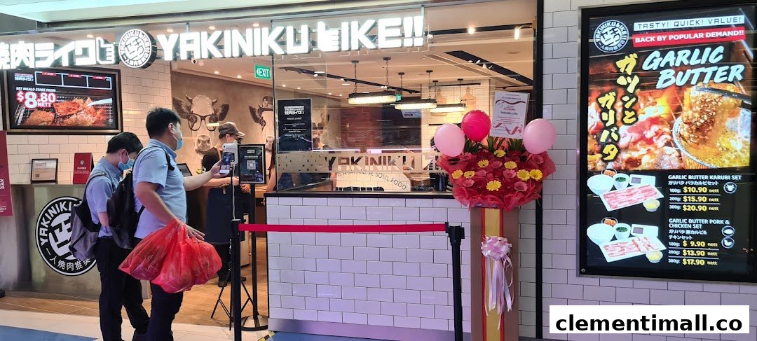 The vibrant storefront of Yakiniku Like, featuring promotional displays and customers entering.