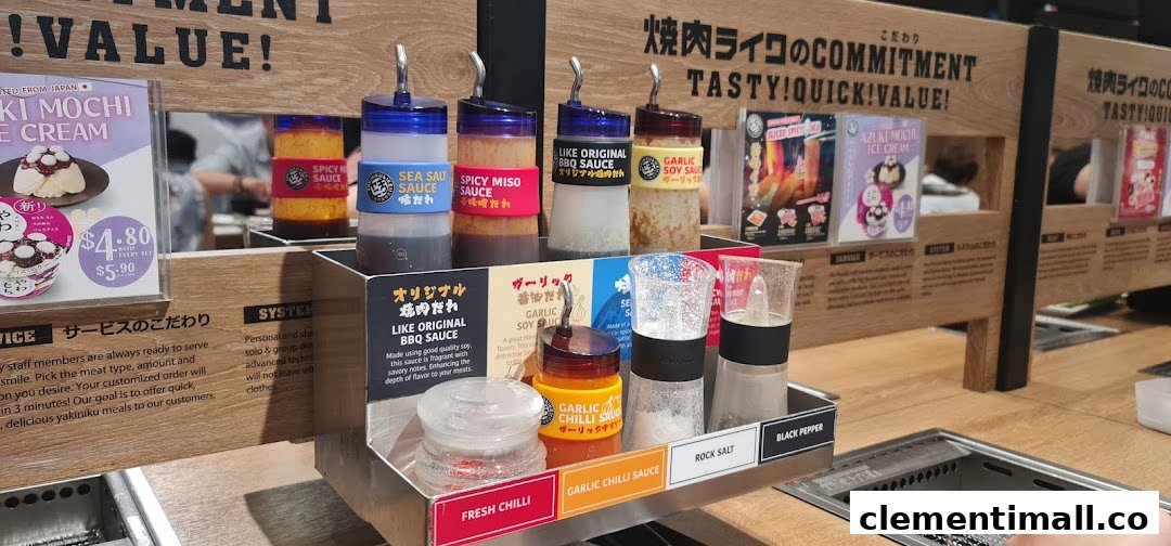 A close-up of a Yakiniku Like dining table featuring various sauces and condiments.