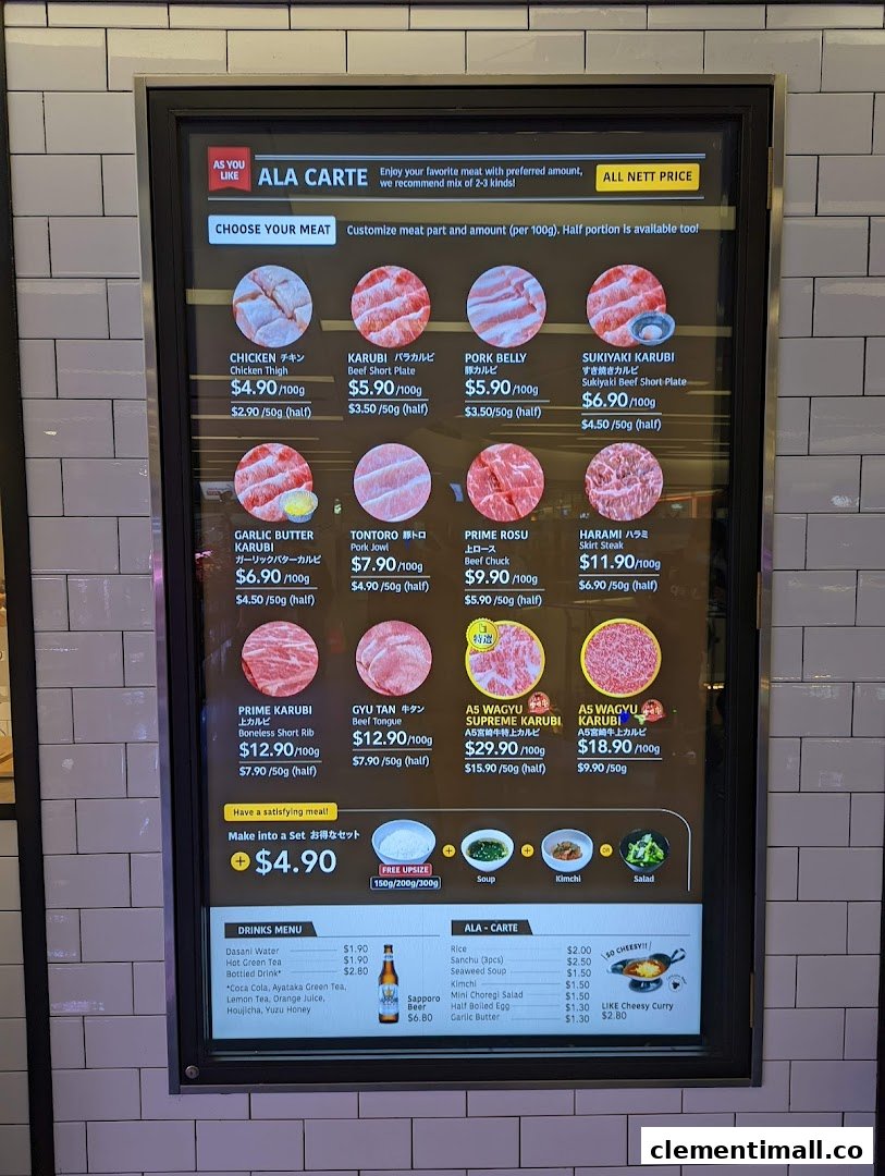 A digital menu board displaying various customizable meat cuts, drinks, and side dishes with prices.