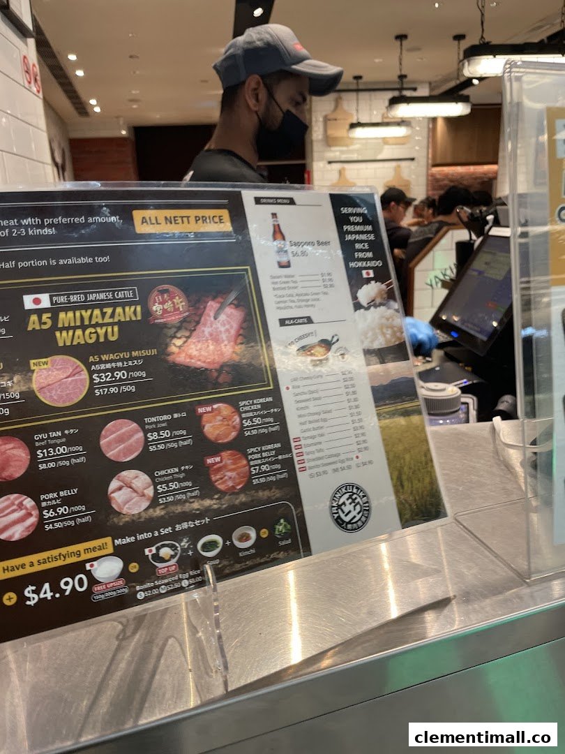 A detailed menu display showcasing various meat cuts, set meal options, and drinks at a Japanese BBQ restaurant.