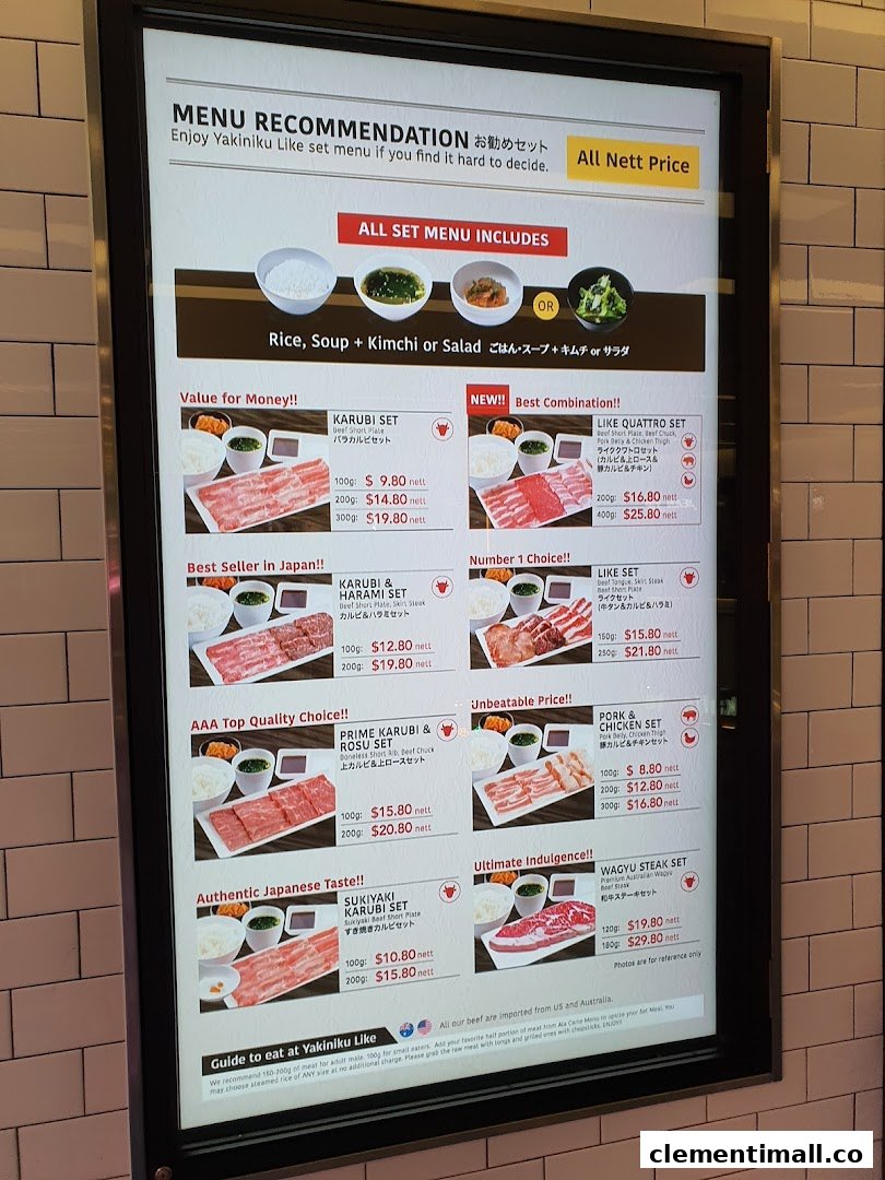 A digital menu board displaying various Yakiniku Like set meals with prices and descriptions.