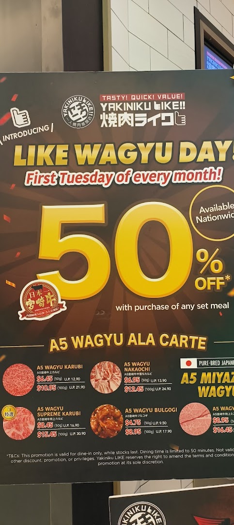 A promotional menu board for Yakiniku Like, featuring A5 Wagyu ala carte items and a 'Like Wagyu Day' discount.