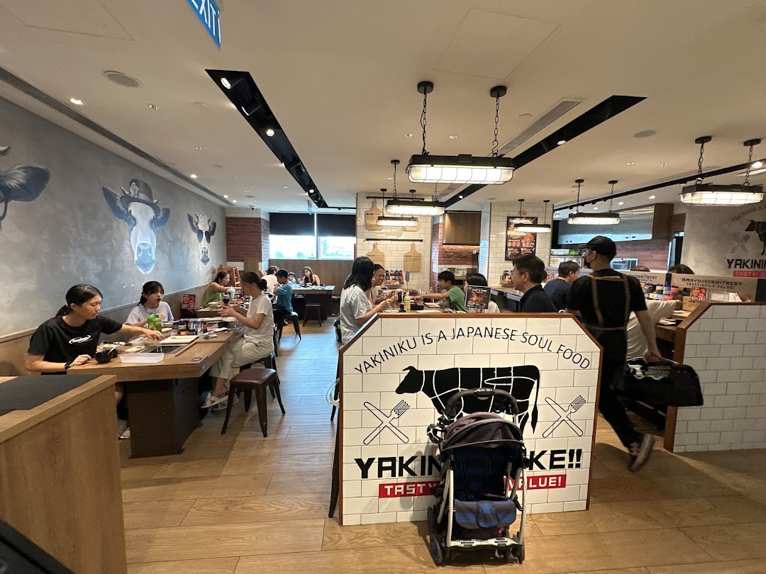 A lively interior view of Yakiniku Like, showing customers enjoying their meals in a modern setting.
