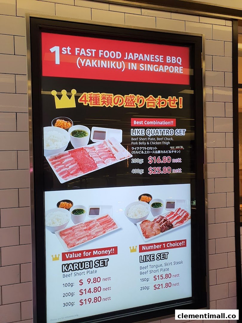 A digital menu board displaying various Japanese BBQ sets with prices and descriptions.