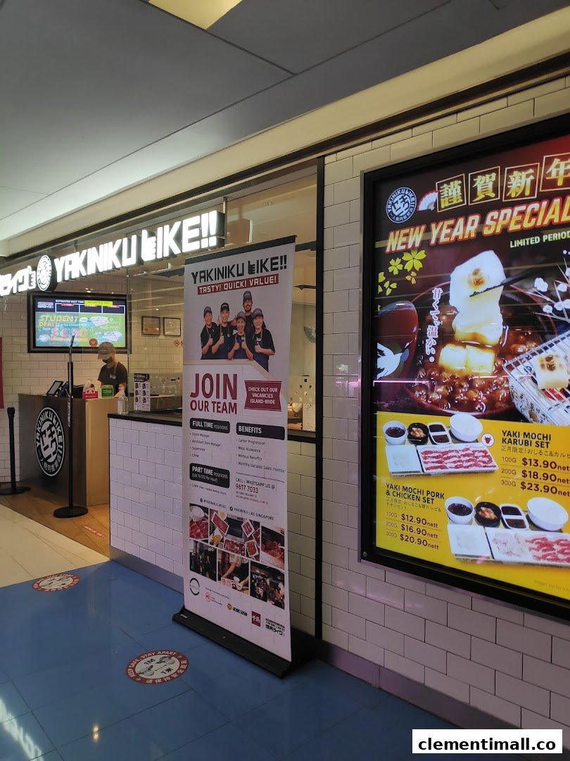 The inviting entrance of Yakiniku Like, showcasing its signage and current promotional displays.