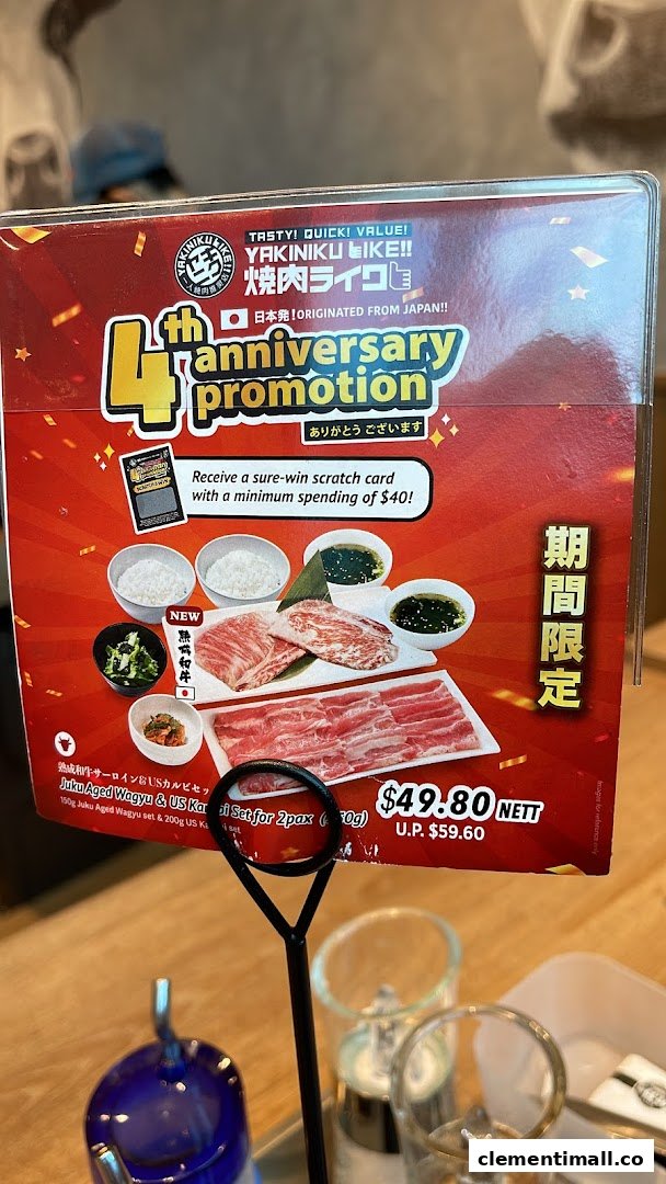 A promotional menu stand showcasing Yakiniku Like's 4th anniversary special set.