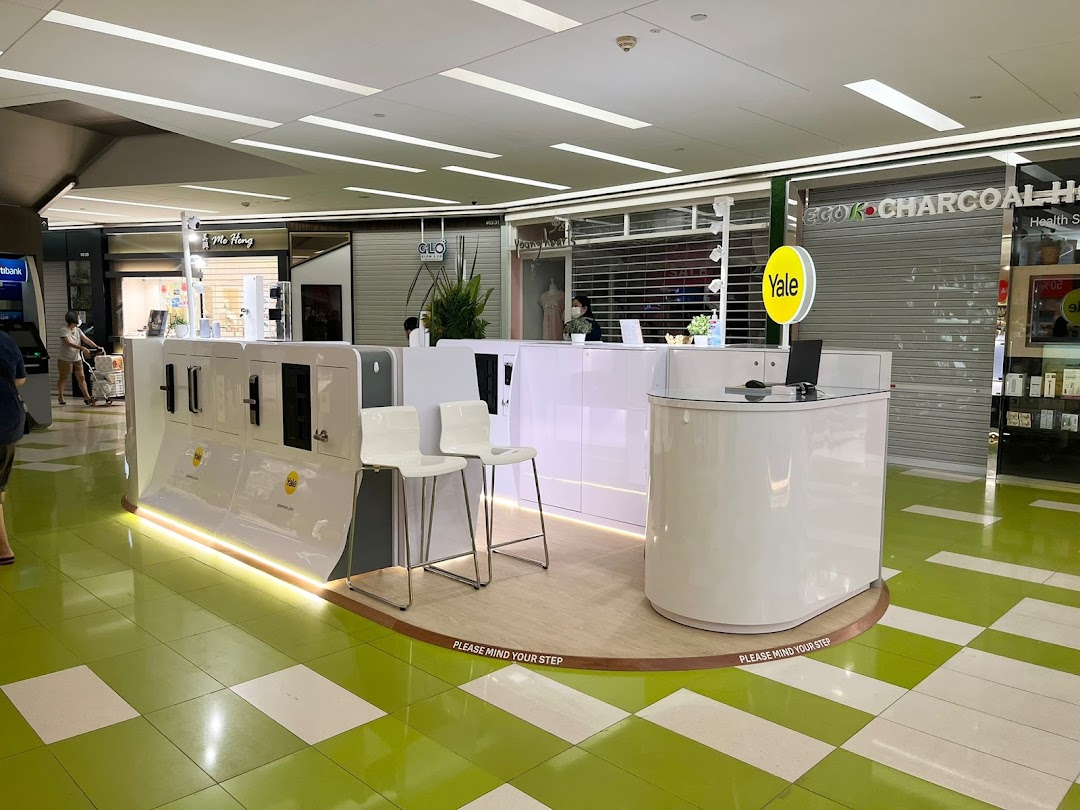 A modern Yale Smart Shop kiosk showcasing smart home security products in a mall common area.