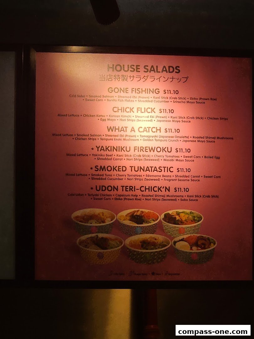 A menu board displaying various house salad options with ingredients and prices.