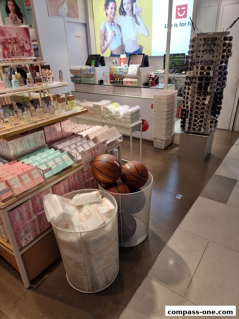 Interior view of a MINISO store showcasing various products like perfumes, skincare, and basketballs.