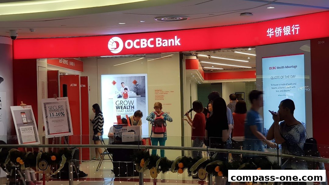 The OCBC Bank branch entrance with ATMs and promotional displays.