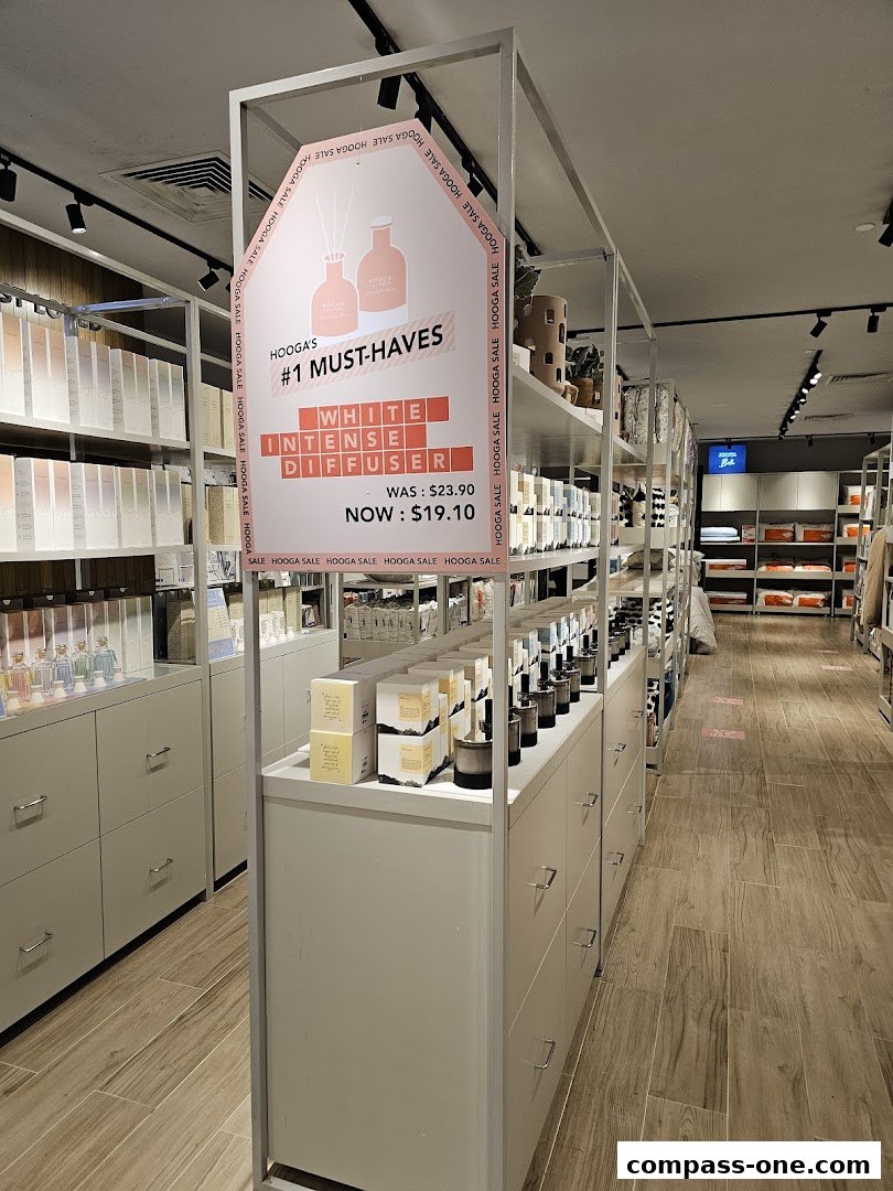 Interior view of a HOOGA store showcasing a sale on white intense diffusers and other home decor items.