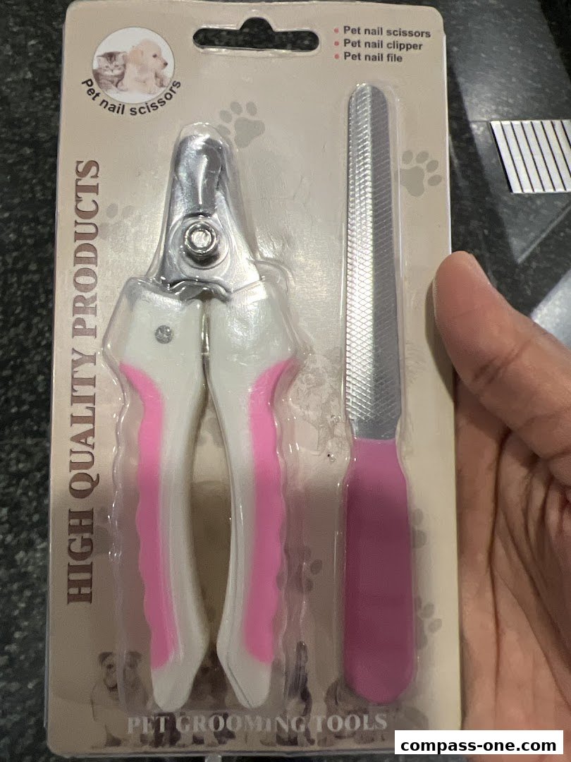 A package of pet grooming tools, including nail scissors and a nail file.