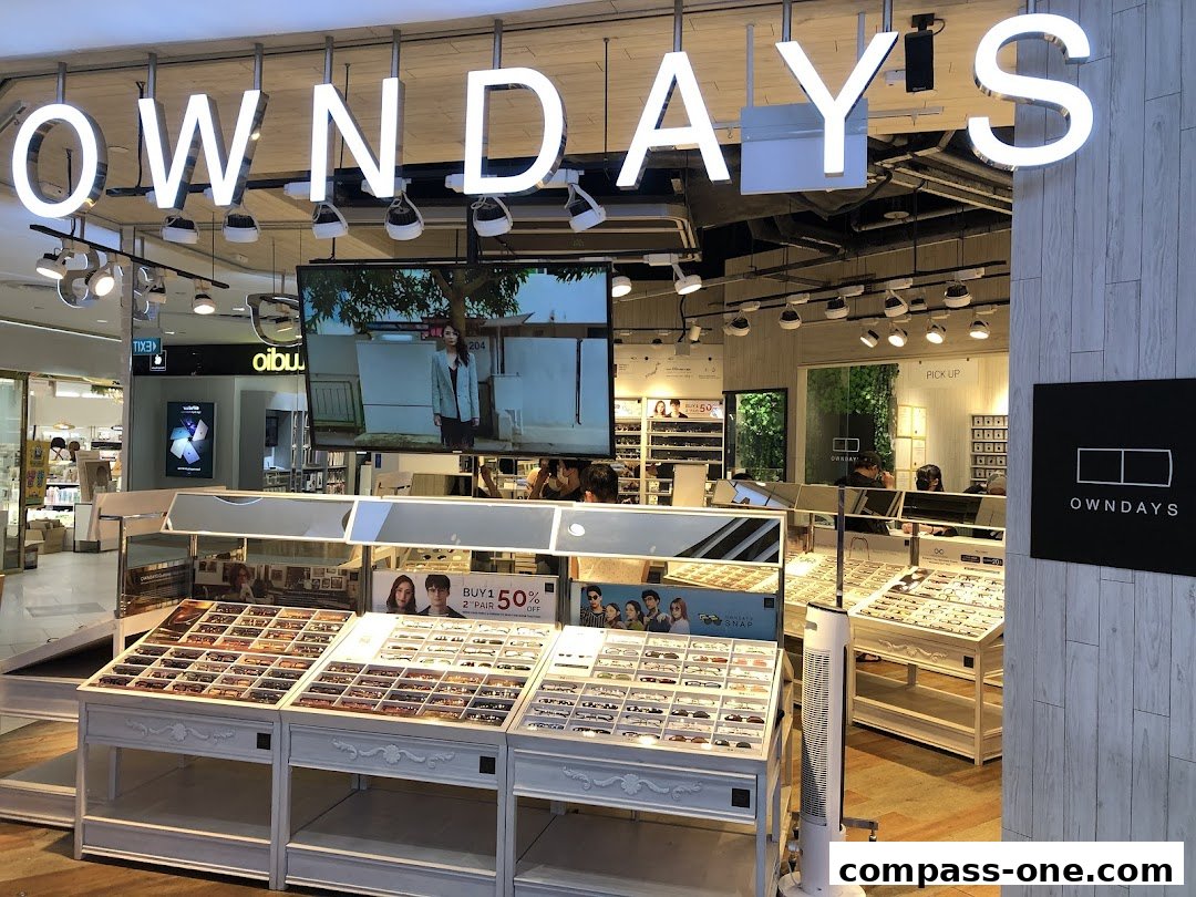 Interior view of an OWNDAYS optical shop showcasing a wide selection of eyeglasses.