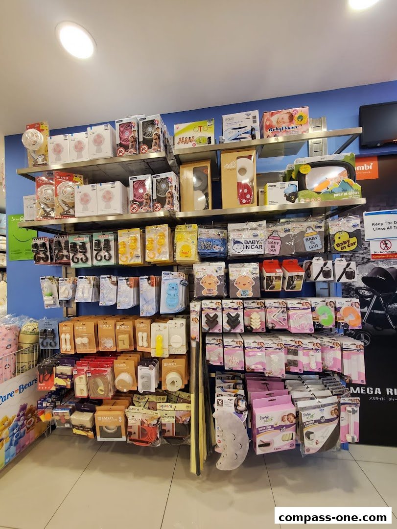 Shelves stocked with baby care products, fans, and safety items.