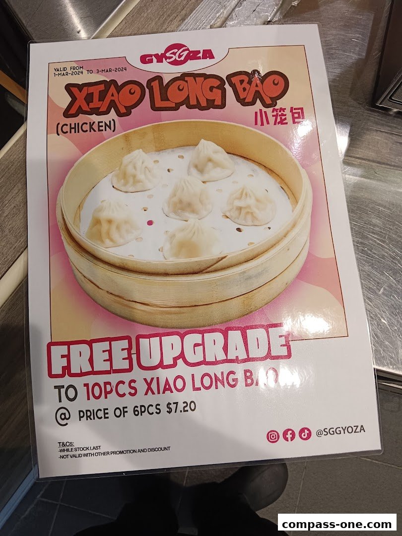A promotional flyer for Xiao Long Bao with a free upgrade offer.