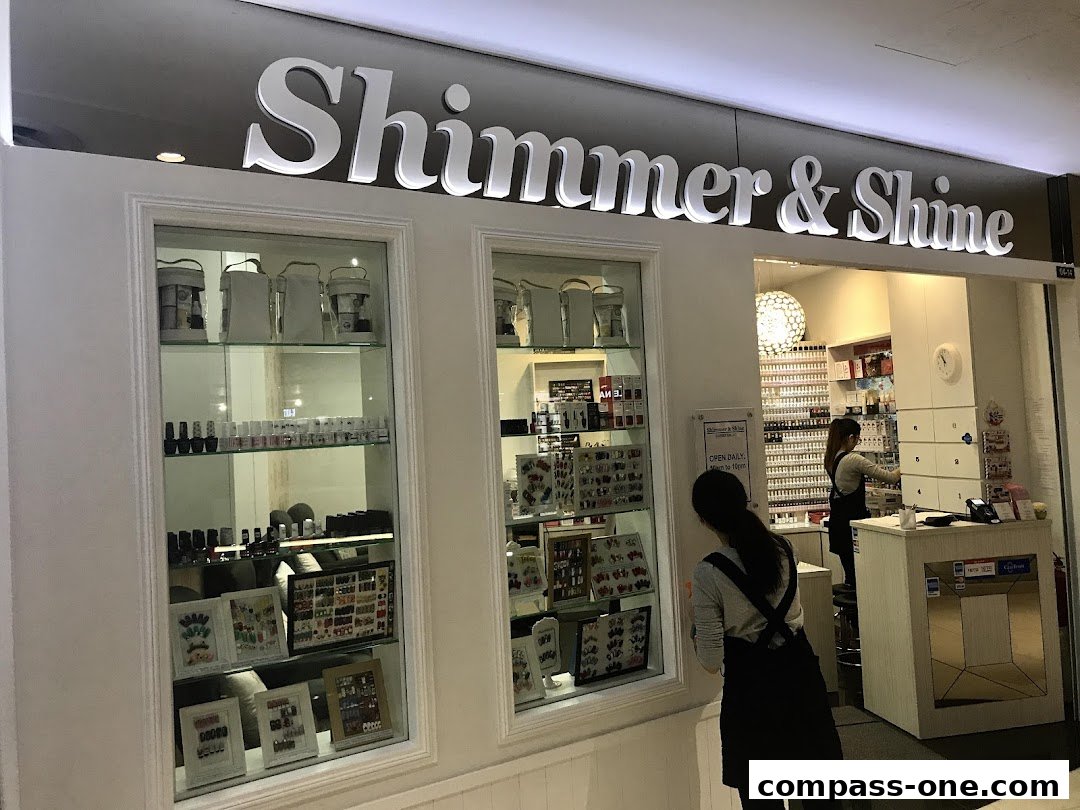 The Shimmer & Shine shop front displays nail polish and accessories in glass cabinets.