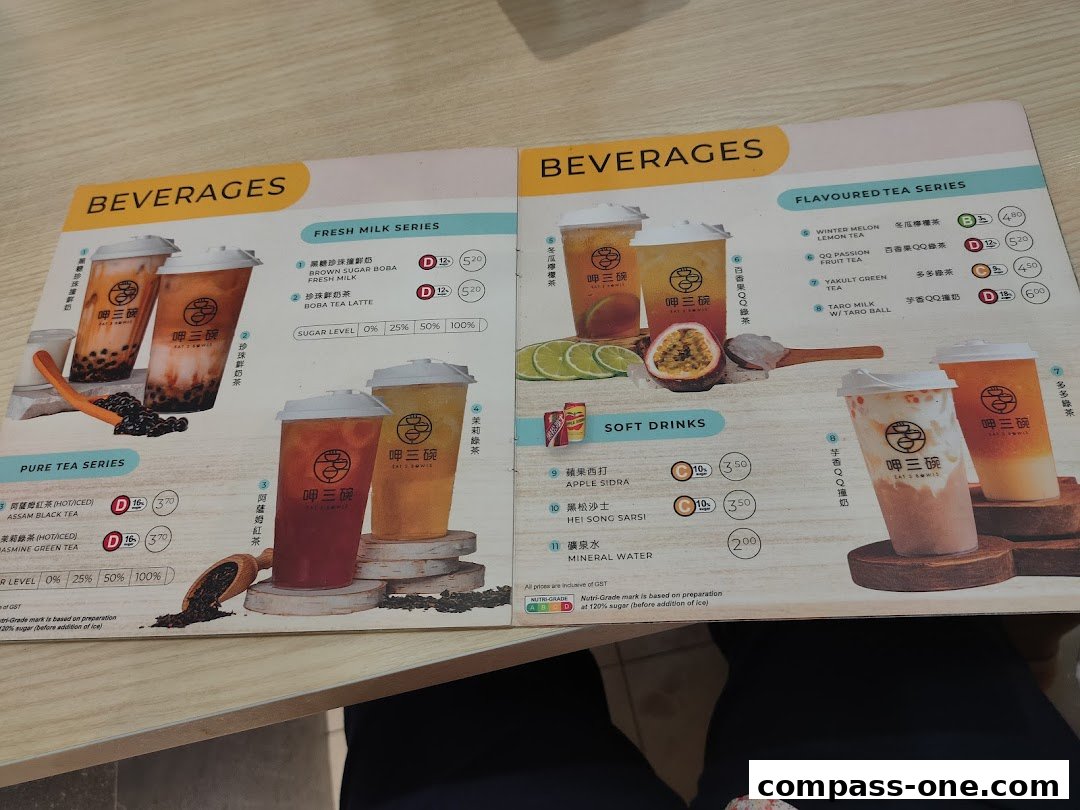 A menu from Eat 3 Bowls featuring various beverages including fresh milk, pure tea, flavored tea, and soft drinks.