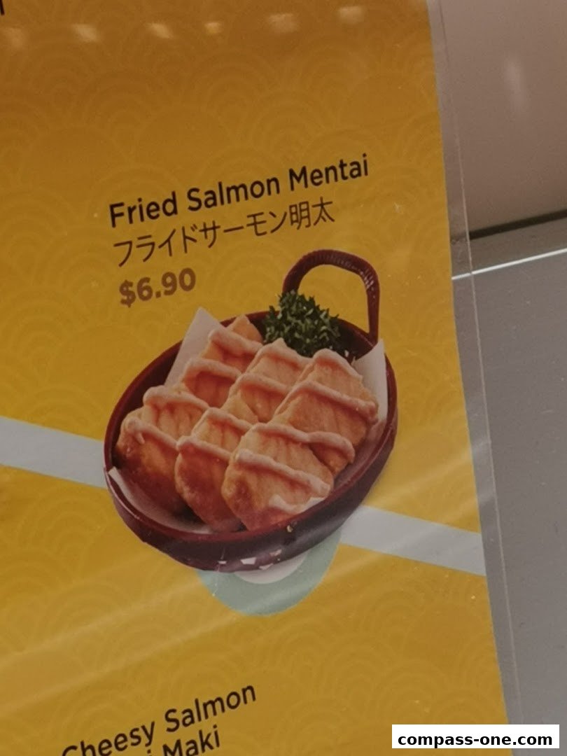 A close-up of a menu item featuring fried salmon mentai with a price.