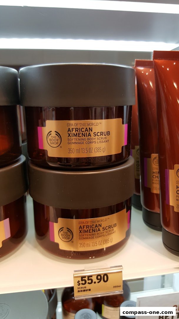 The Body Shop African Ximenia Scrub displayed on a shelf with a price tag.