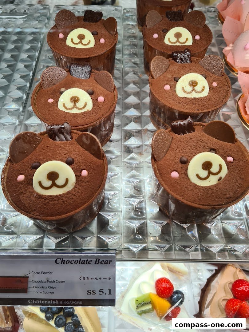 Close-up of adorable chocolate bear cakes with a price tag and ingredients list.