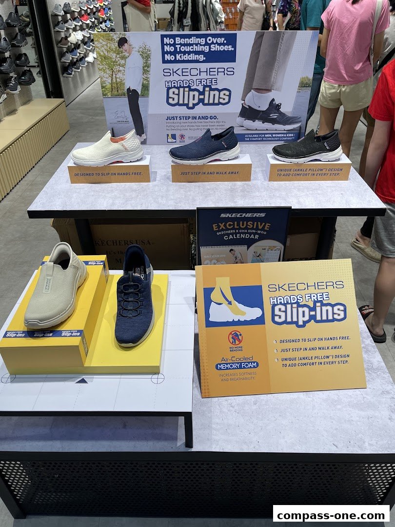 Skechers store display featuring Hands Free Slip-ins shoes for men, women, and kids.