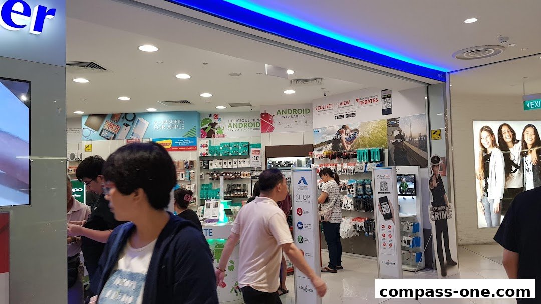 Interior view of a Challenger electronics store showcasing various mobile accessories and displays.